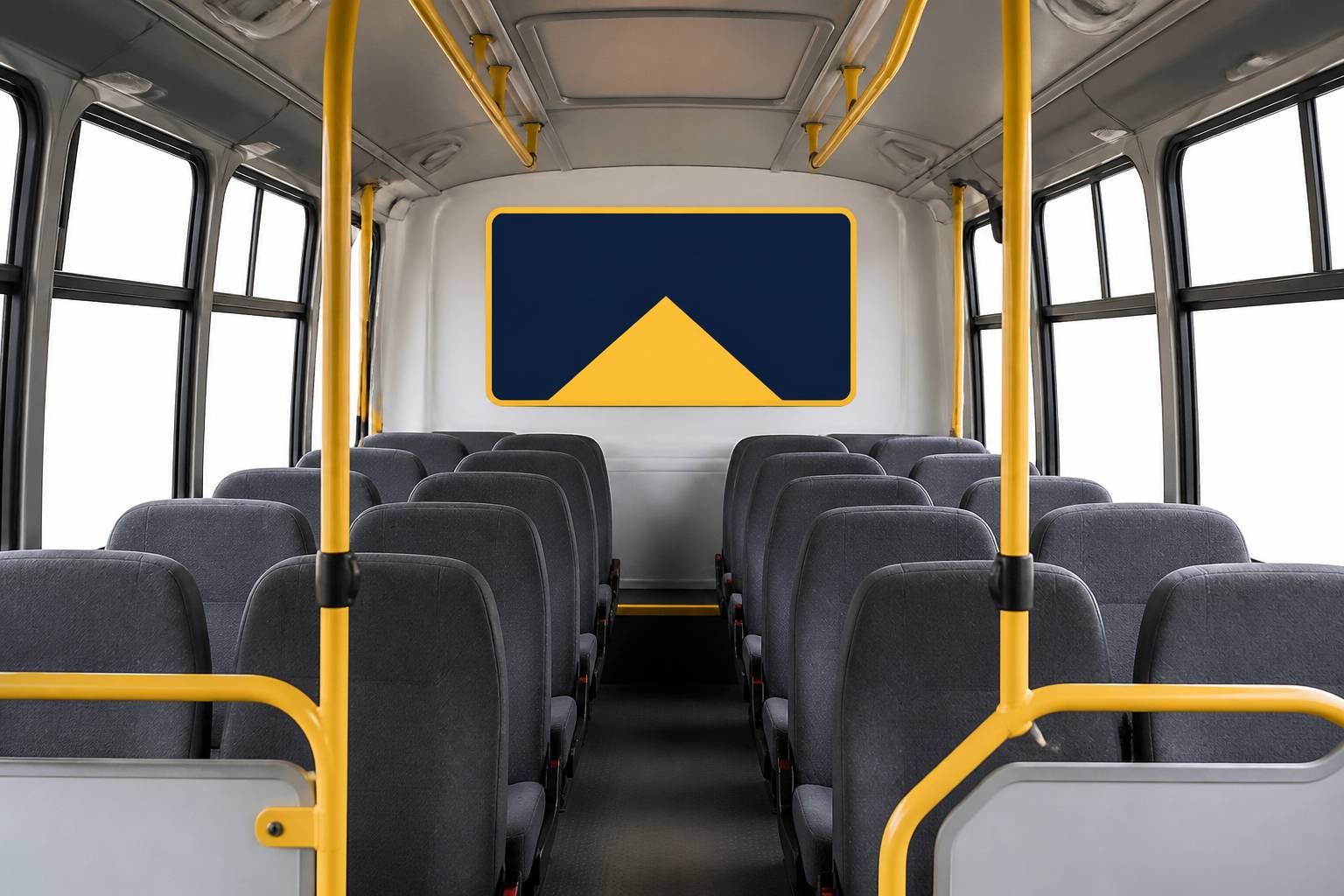 Rangées de sièges gris à l'intérieur d'un minibus avec un couloir central